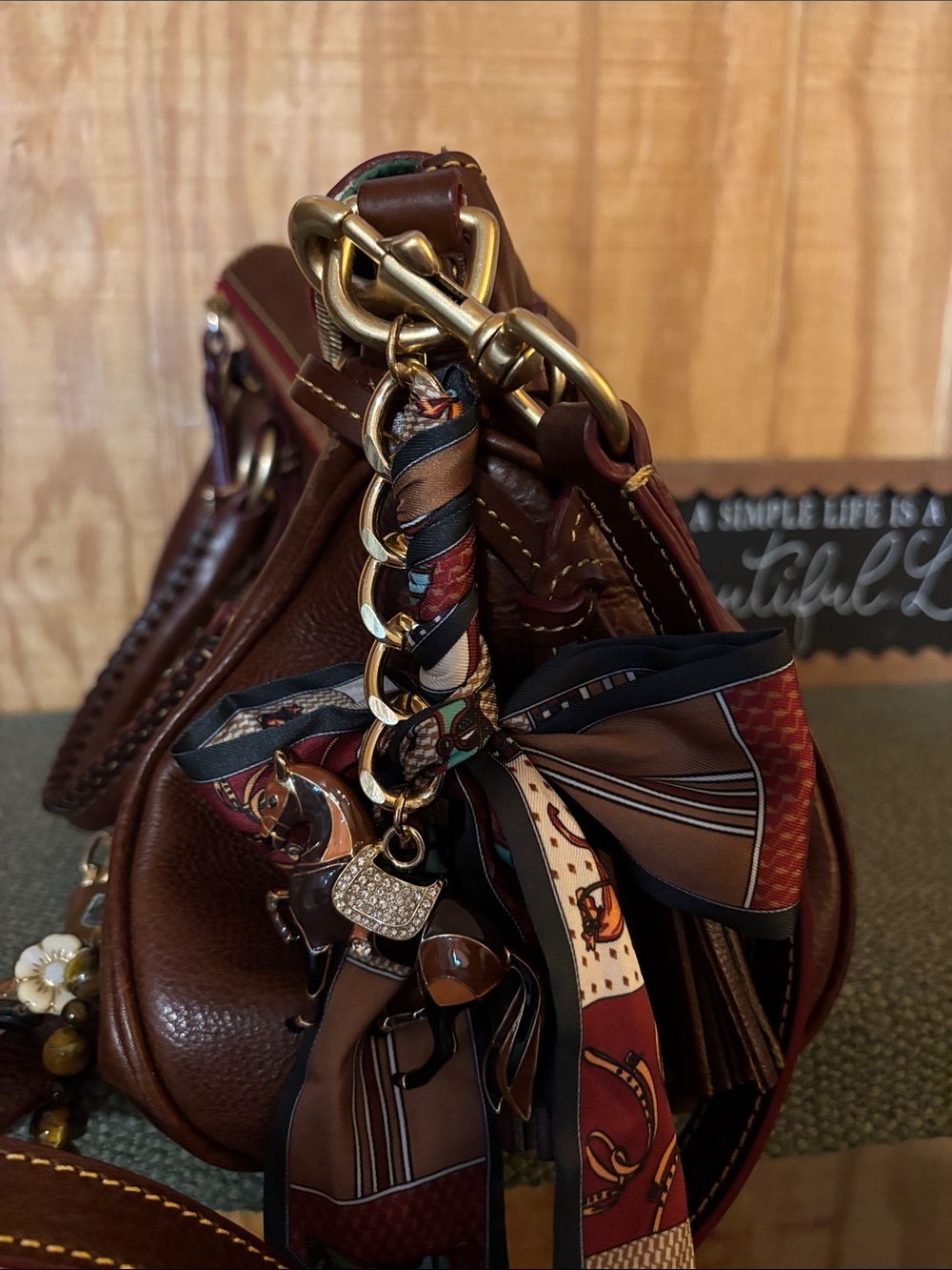 Dooney & Bourke Brown Leather Handbag with Chains & charm accents. - Picture 3 of 5